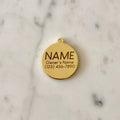 An engraving example of our gold plated brass pet ID tag.